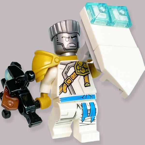 Мініфігурка колекційна LEGO Ninjago 892173 Zane Golden Ninja Мініфігурка Зейна з &laquo;Володаря гори&raquo; з закидувачем лука Лего Ніндзяго 892173 фото